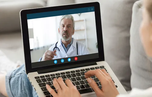 Doctor providing online consultation via video call